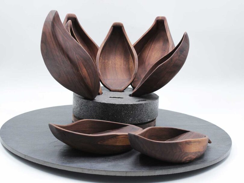 grey stand with wooden leaf like bowls