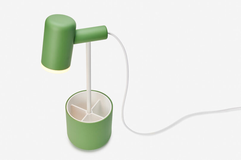Fieldtrip lamp in green with caddy base and white cord.