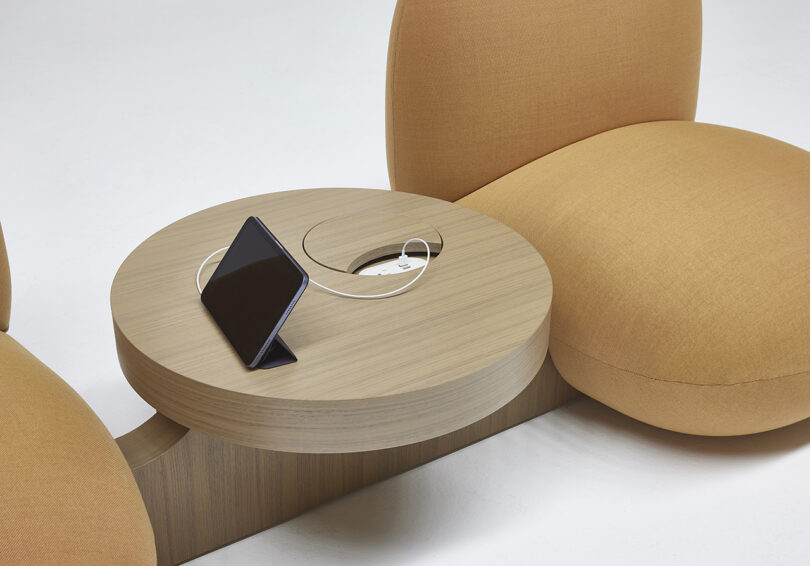 two bulbous overstuffed chairs with side table that offers connectivity