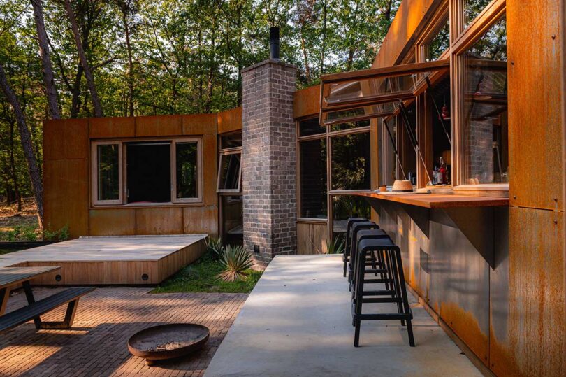 partial exterior view of modern home with corten steel exterior