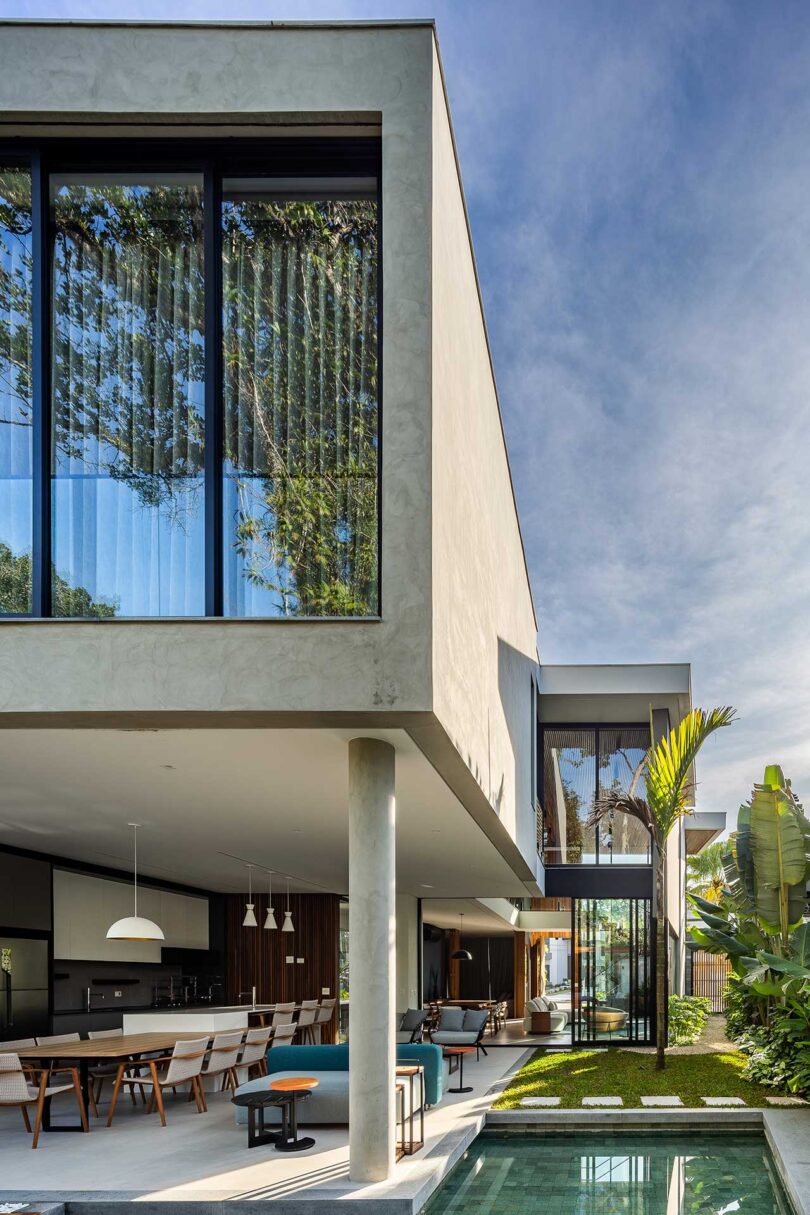 partial rear exterior view of modern house with extended covered patio and pool