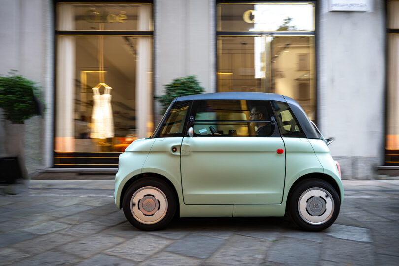 street view side of small mint-colored Fiat car