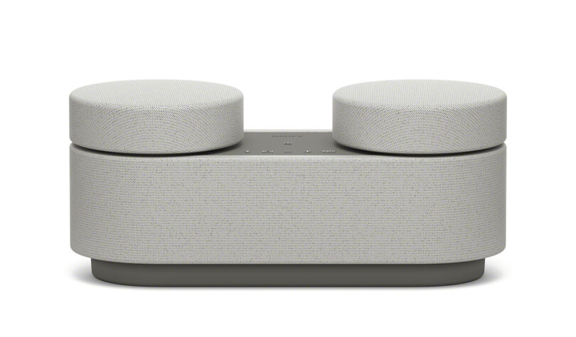 Side view of Sony HT-AX7 home theater speaker system against white background.