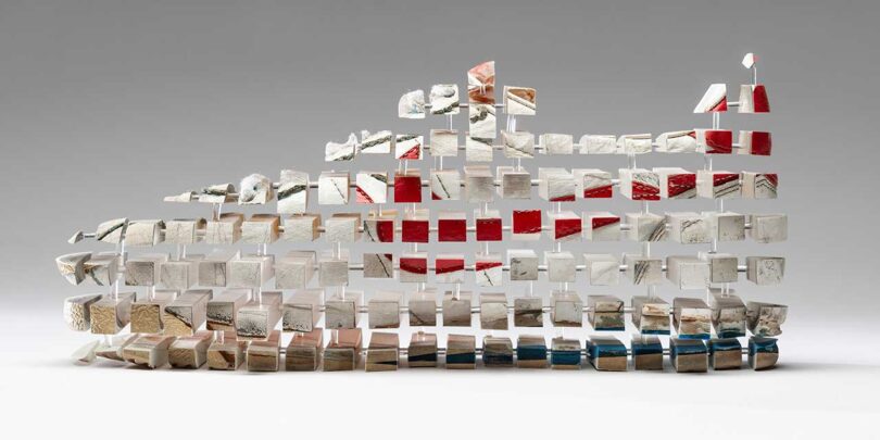 image of a Nike show broken up into cubes and reattached with rods