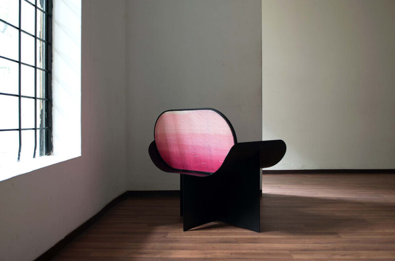 modern black armchair with pink gradient backrest