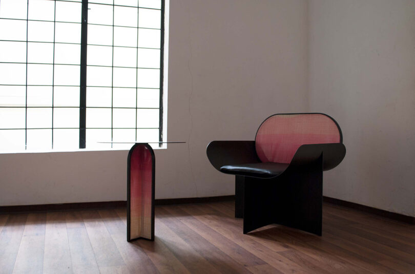 modern black armchair with pink gradient backrest and side table chair with pink gradient base