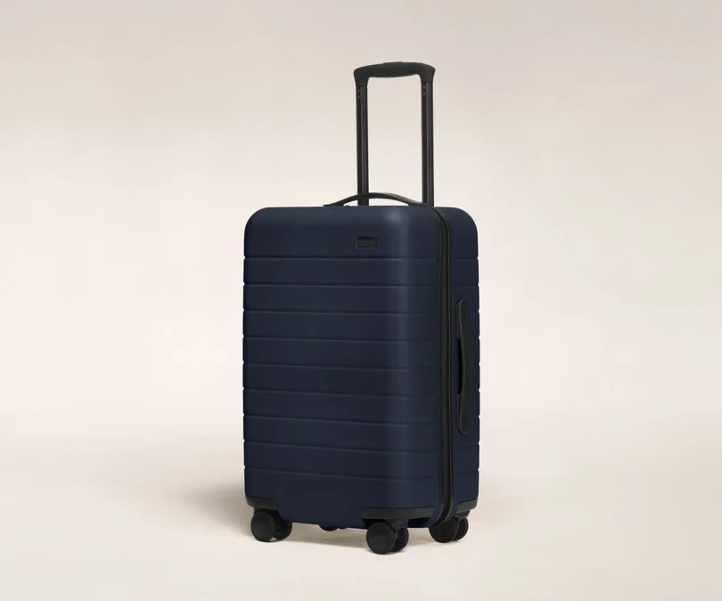 hardshell carry-on suitcase on a white background