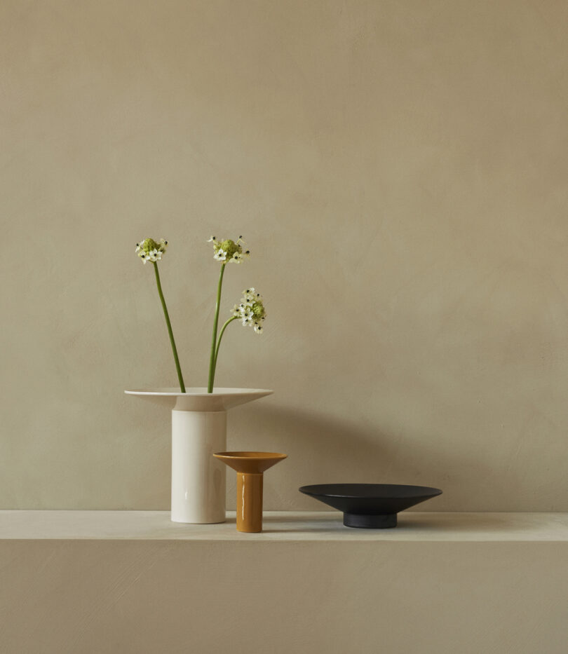 three modern vases of differing heights and colors