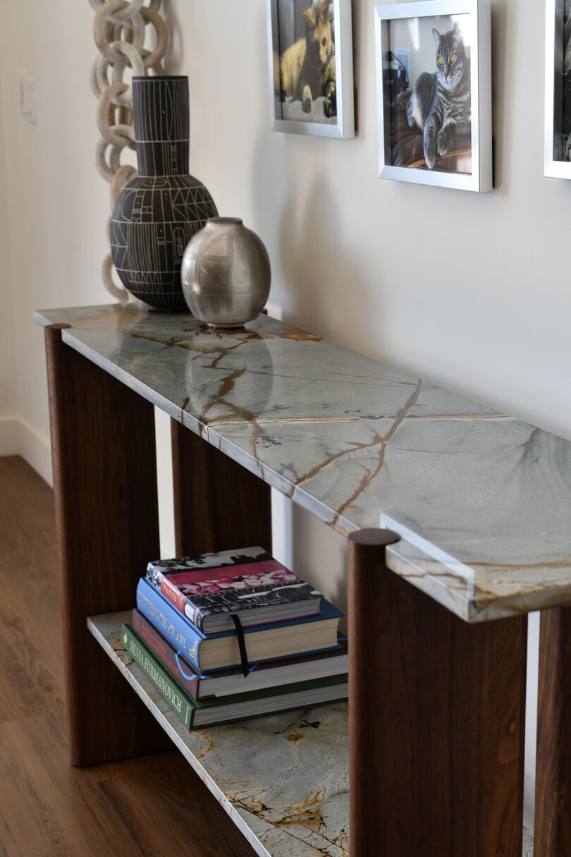 dark wood console table with grey marble top
