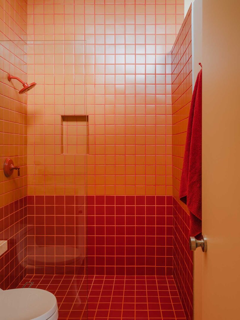 modern bathroom with rusty red and pink mosaic tiles
