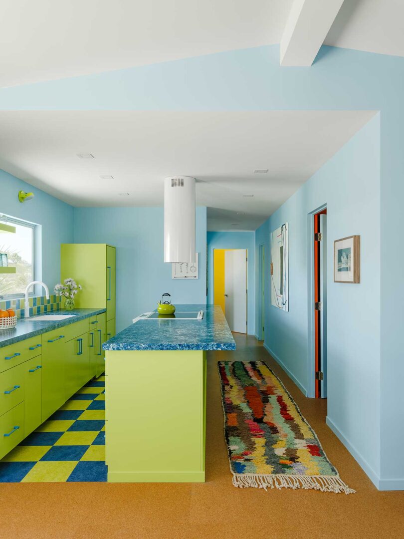 end view of colorful kitchen in lime green and aqua colors