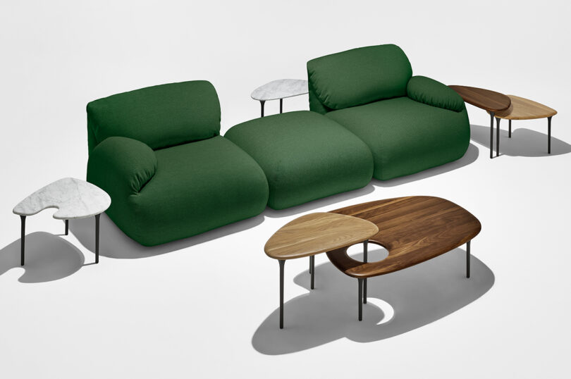 dark green modular sofa and nesting tables