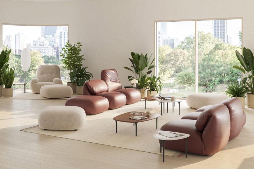styled interior space with brown leather modular sofa and nesting tables