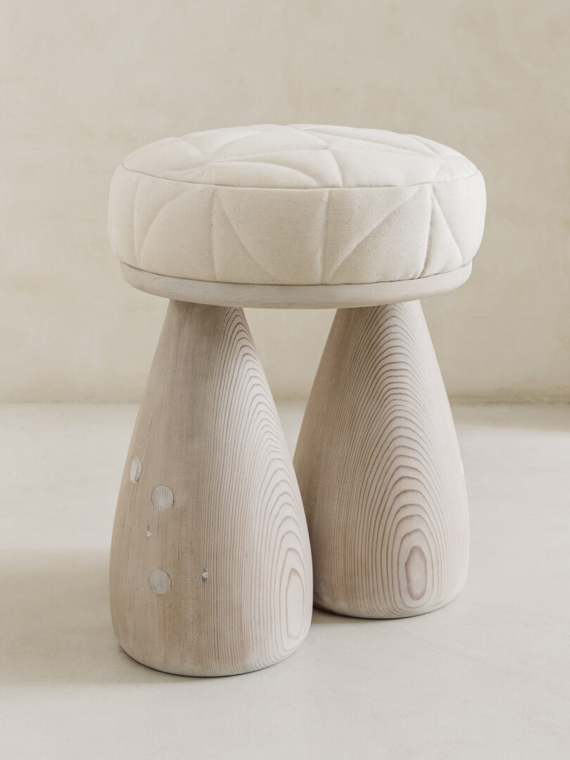 padded stool made from salvaged wood and deadstock canvas material