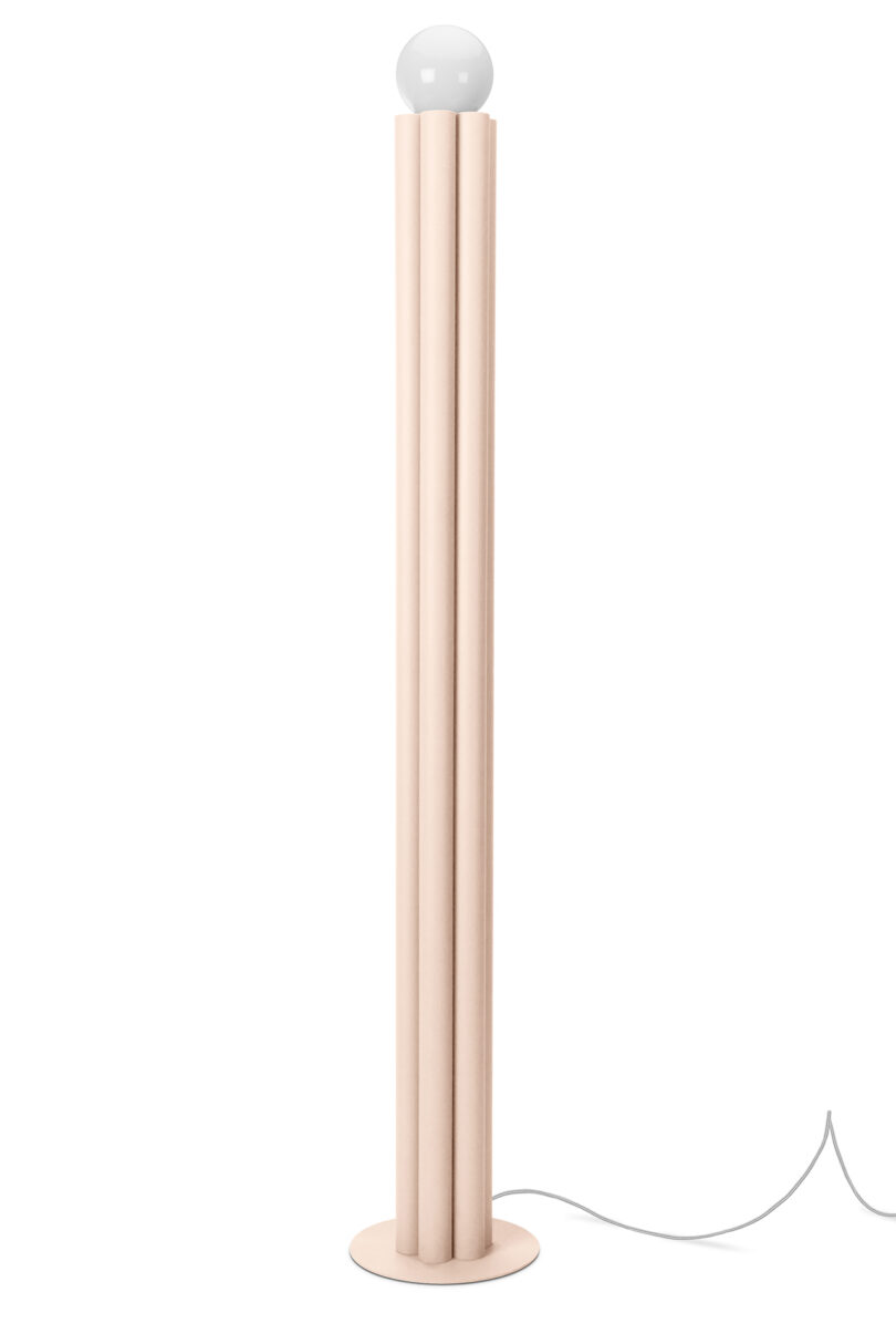 fluted light pink floor lamp on a white background