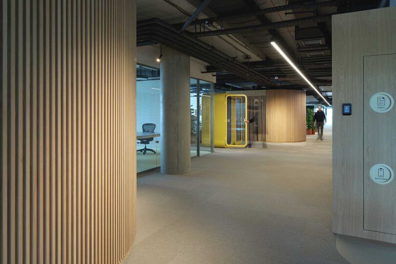 view of large modern office space with various types of seating 