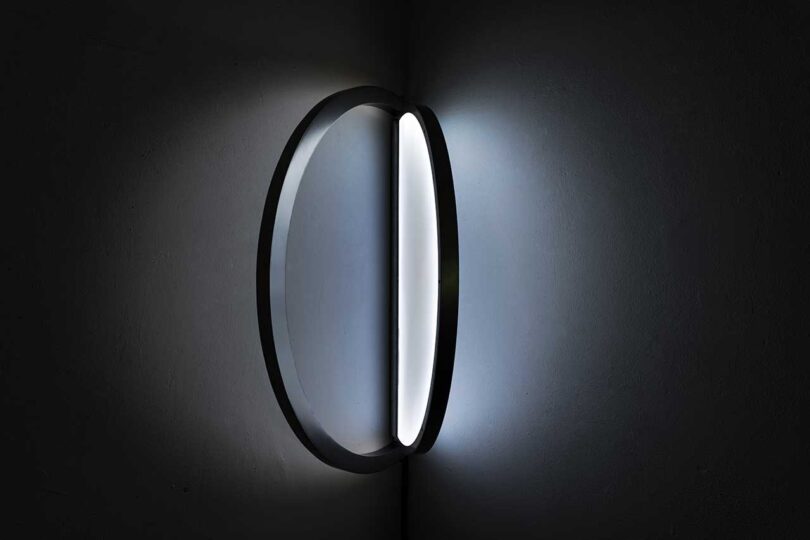 oval-shaped wall light that resembles a window when illuminated