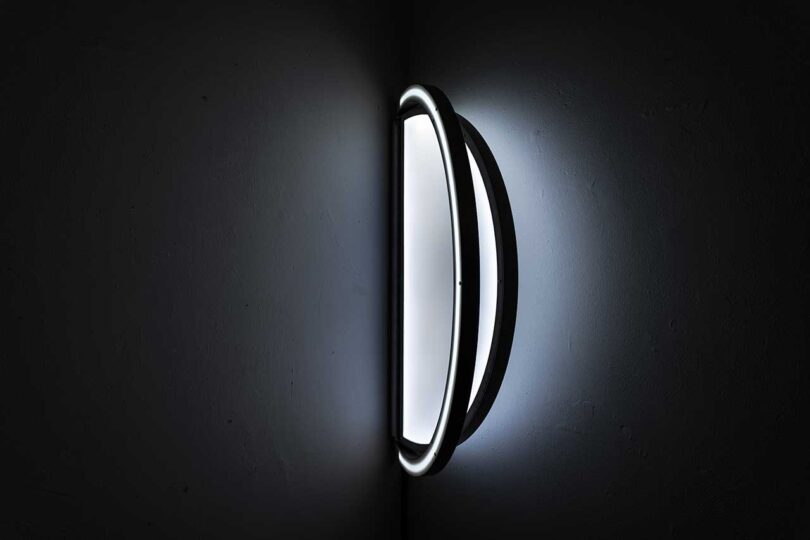 oval-shaped wall light that resembles a window when illuminated