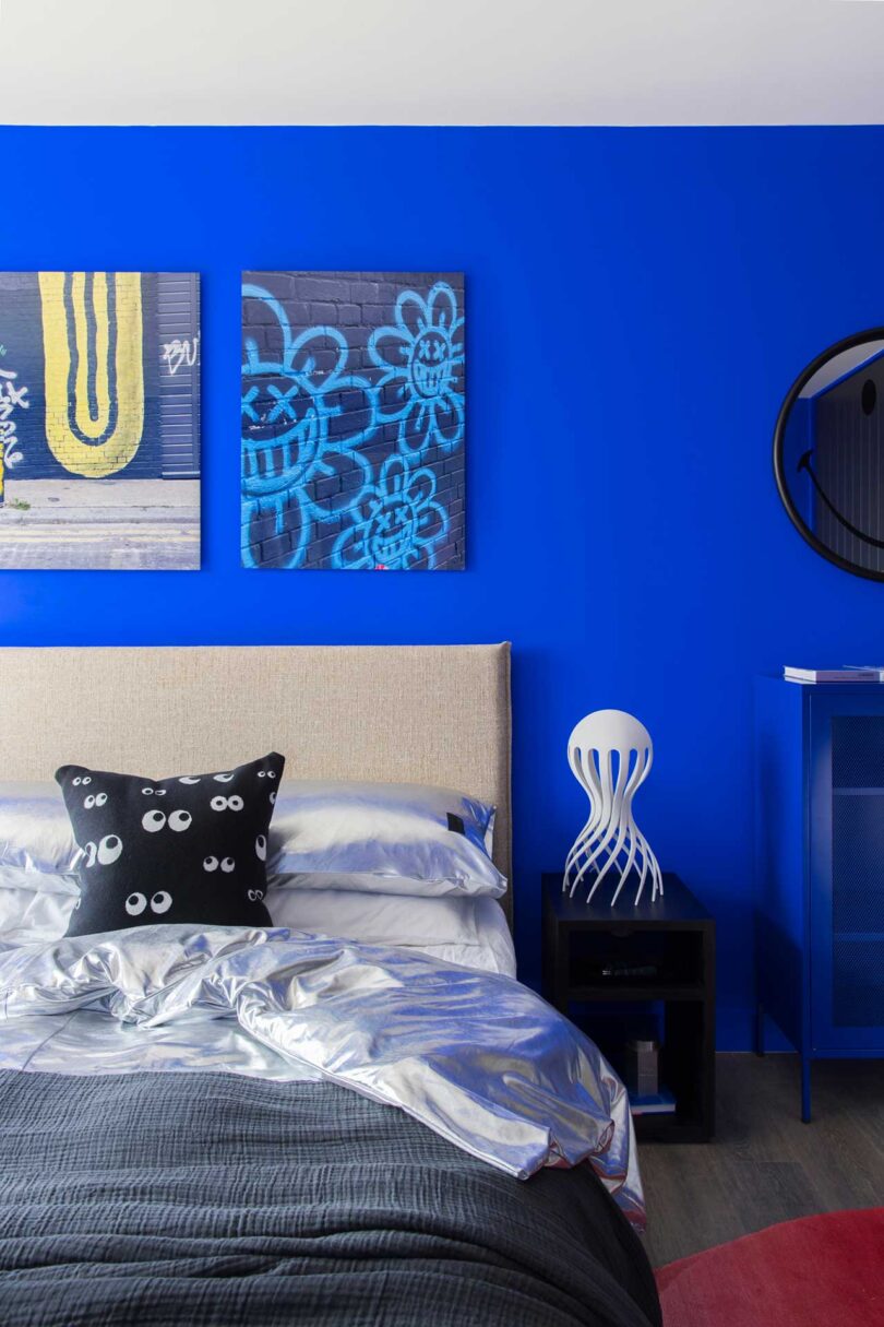 partial split view of modern bed in bright blue bedroom