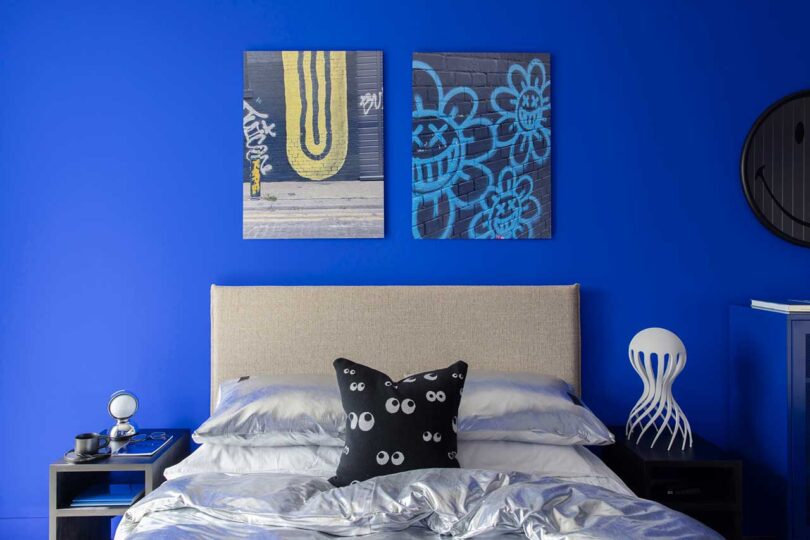 view of modern bed in bright blue bedroom