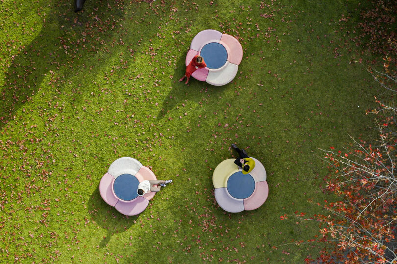 overhead image of colorful circular outdoor benches that slowly spin