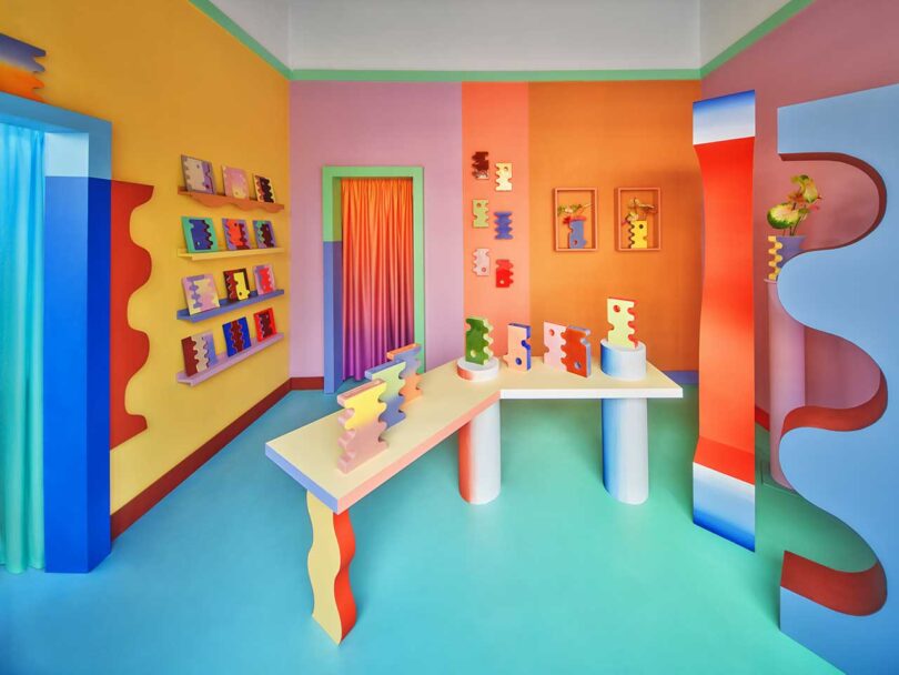 vibrant and colorful interior space with quirky table and furnishings showcasing a collection of bright colorful vases