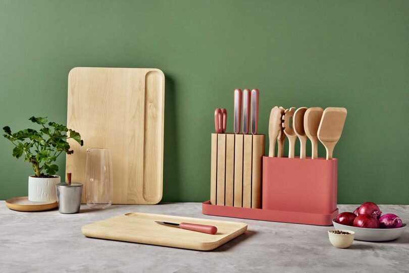 style set of pink and wood knife, utensil, and cutting board sets