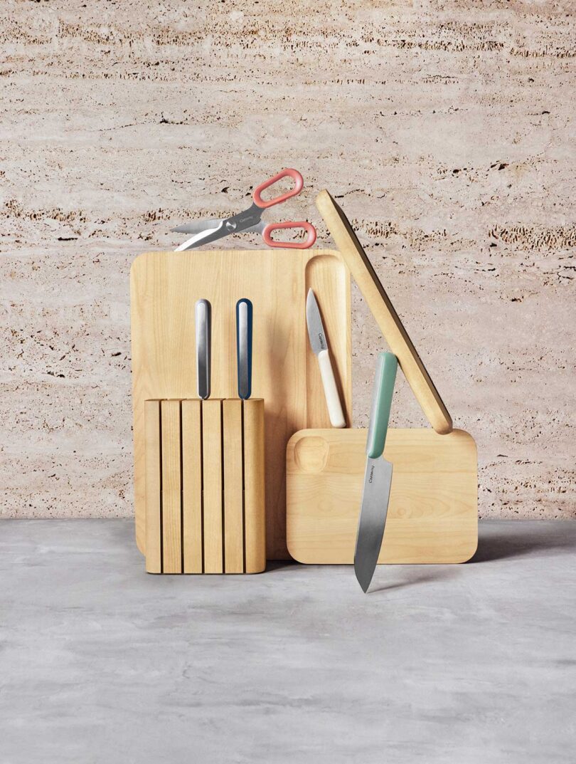 style shot of wood knife block and multiple cutting boards