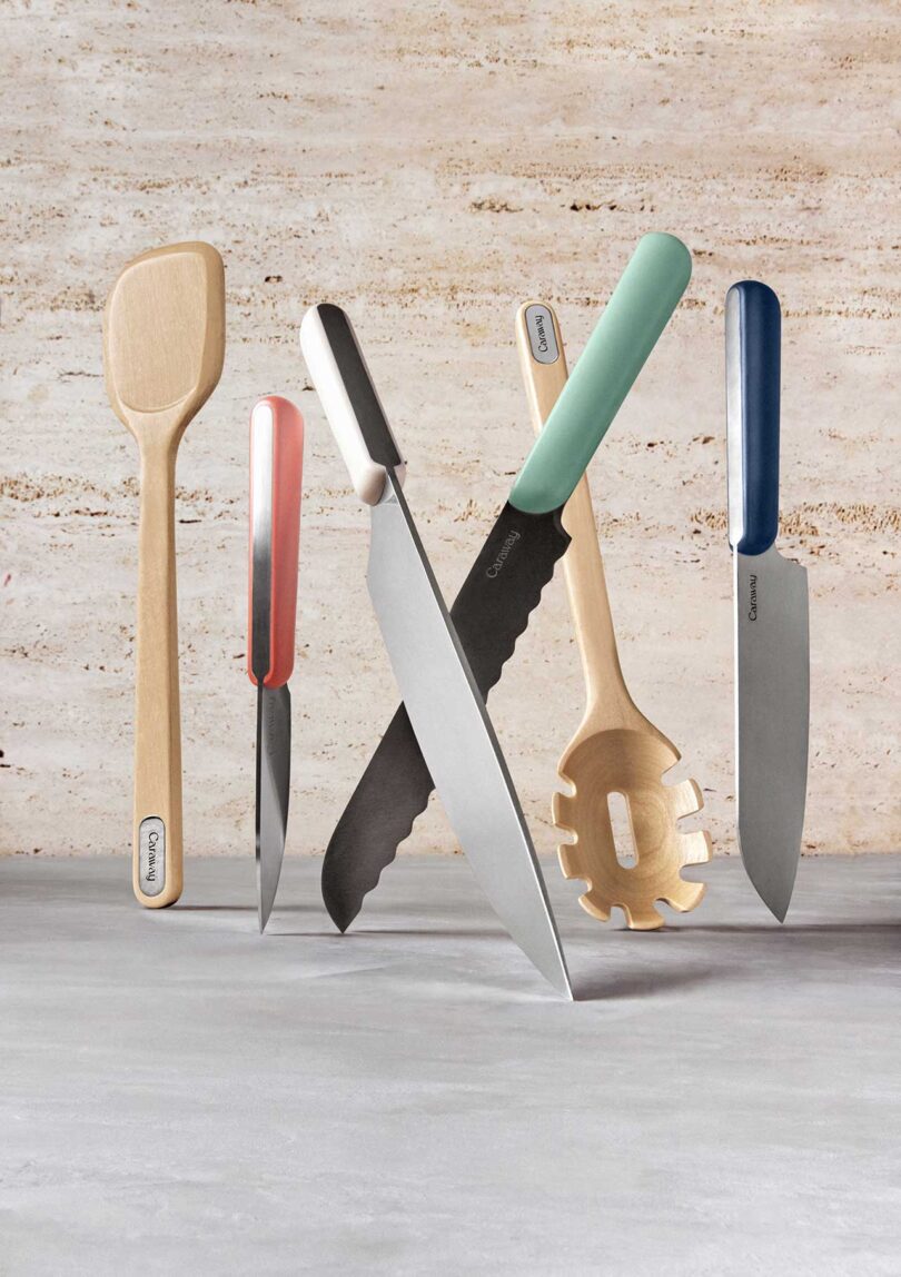 styled shot of suspended kitchen utensils and knives