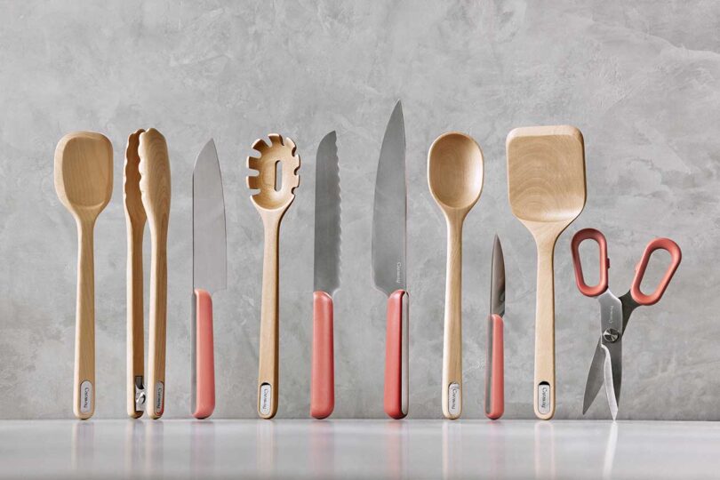 styled shot of wooden utensils and knives standing up