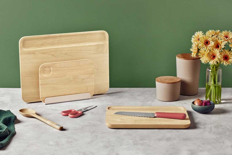 styled shot of set of wooden cutting boards and various utensils