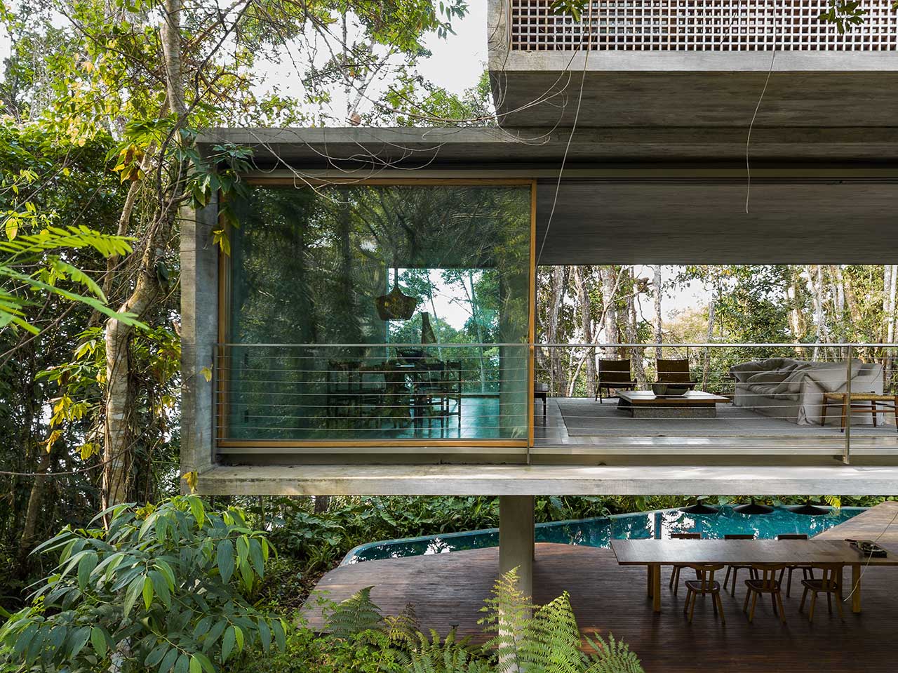 Casa Azul Is a Raised Concrete Home in a Brazilian Forest