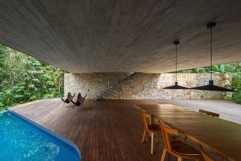covered open deck with partially covered pool and dining area