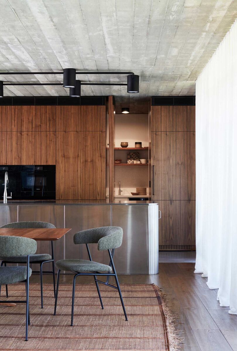 interior view of modern kitchen with wood and stainless cabinets