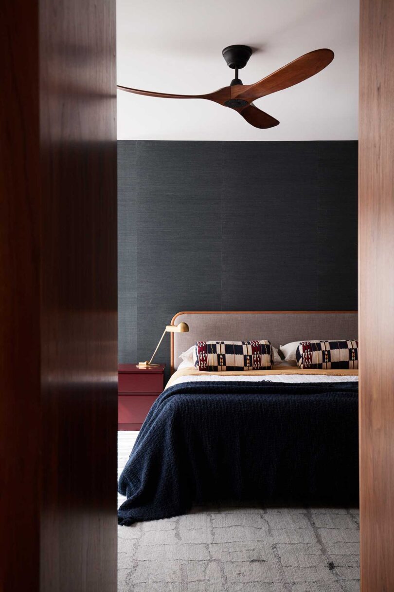 partial interior view of modern bedroom with dark decor