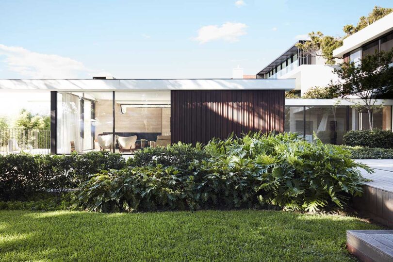 exterior side view of modern house with brown and white exterior