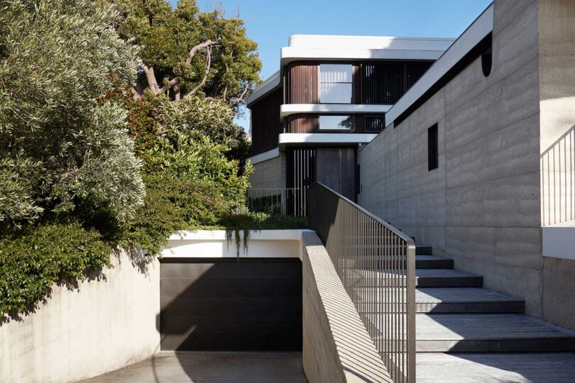 front exterior view of modern brown and white curvy house