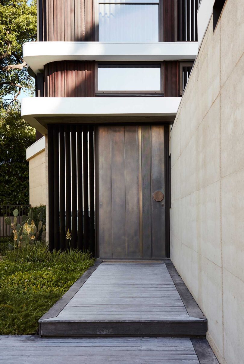 close front door view of wood and white house