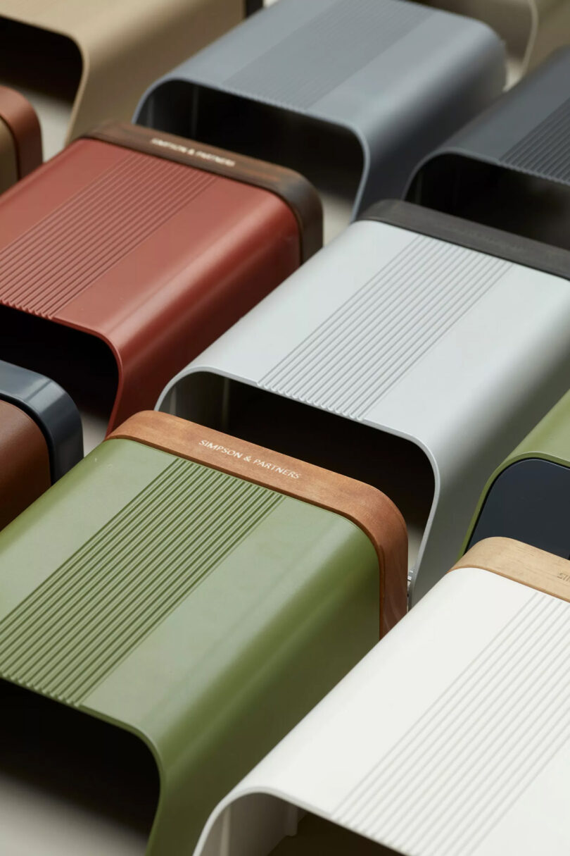 A grid of Simpson & Partners EV charging system laid flat and in numerous color combinations, showing how to mix and match case with wooden and metal tops.
