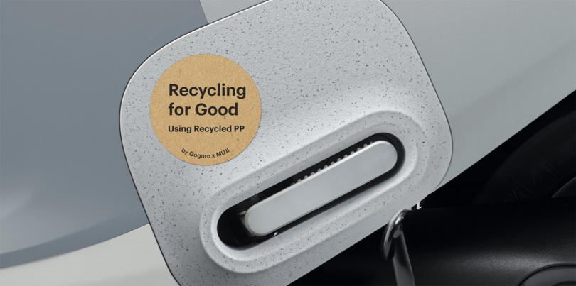 Detail of circular sticker labeled with "Recycling for Good" on Gogoro electric scooter, bringing attention to its use of recycled plastic in its manufacturing.
