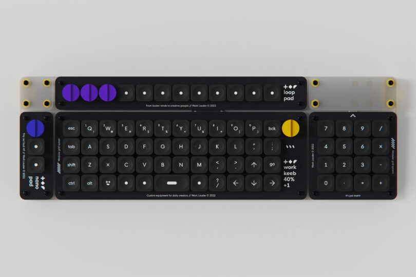 Overhead view of Creator Board XL keyboard showing its aligned grid layout and outfitted with numeric keypad attached and all four rotary dials, one blue, three in purple, and the far right in yellow.