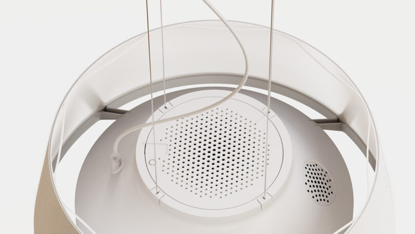 Overhead detail of Nobi pendant lamp in white, showing its two-way speaker system used to aid in communication between caregivers and senior occupants.