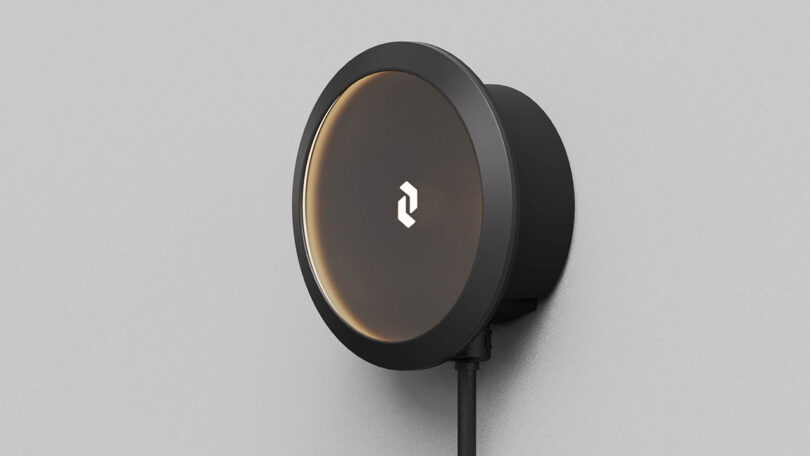 Render of the main Cove EV charging system in black with interior edges glowing softly and EverCharge logo in the middle.