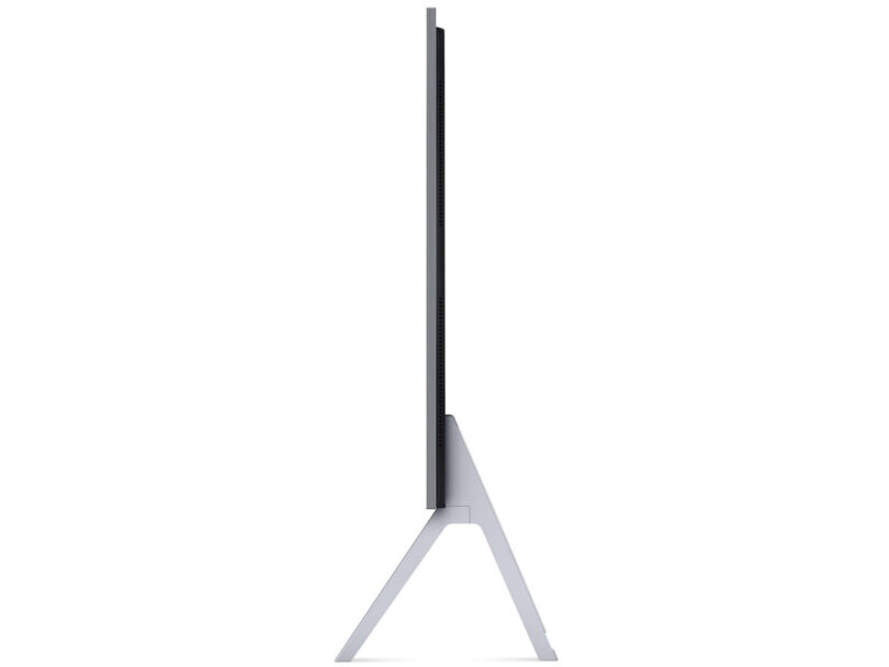 Side view of 97-inch LG OLED television with attached metal floor stand legs, showcasing it's sleek side profile.