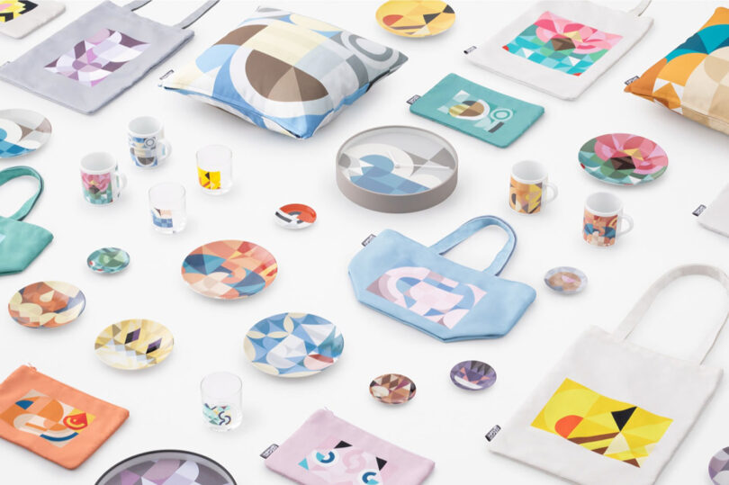 Angled view of the entire 75 piece homewares Pokemon Mosaics collection by Nendo set against a white background.