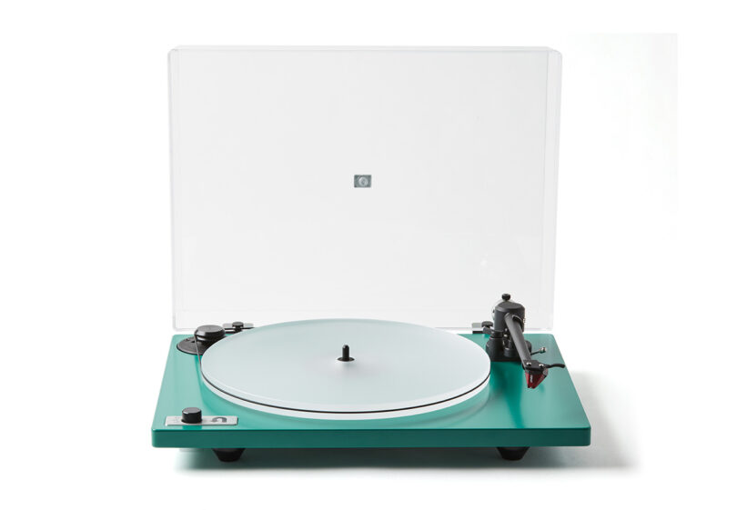Green Orbit Special turntable with clear acrylic platter with Red Ortofon needle and dust cover opened, staged against white background.