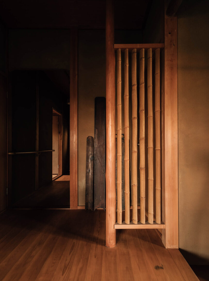 Small vertical bamboo partition connecting the home's entryway into the other sections of the guest tea house.
