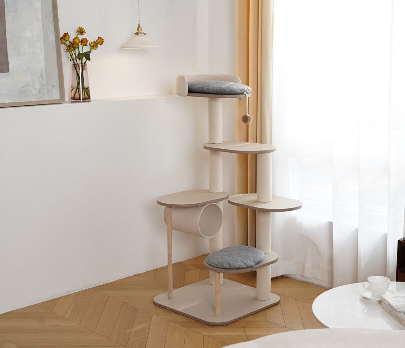 Original Infinity Cat Tree configuration, shown in four tiered levels with circular padded bed at the top, tube cubby hole and dangling pet toy, and small padded rest section.