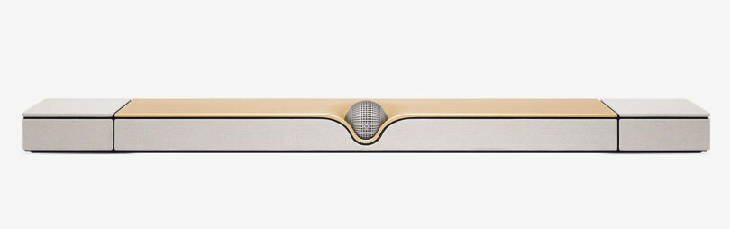 Front views of special edition Devialet Dione Opéra de Paris soundbar, with spherical center speaker in the front center and gold leaf covered top.