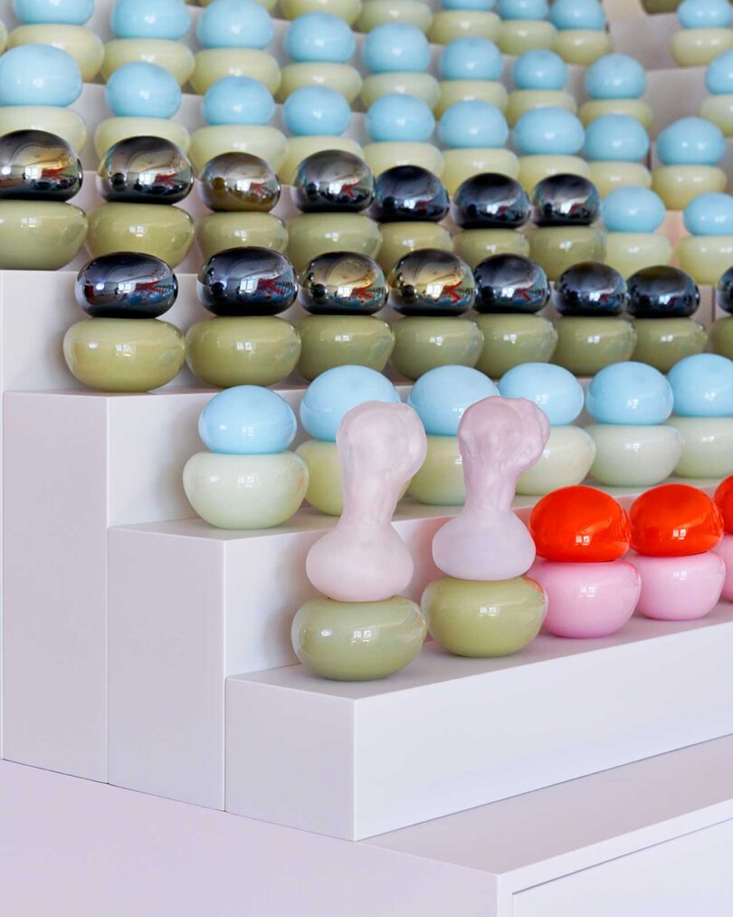 tiered display of two-toned colorful glass objects